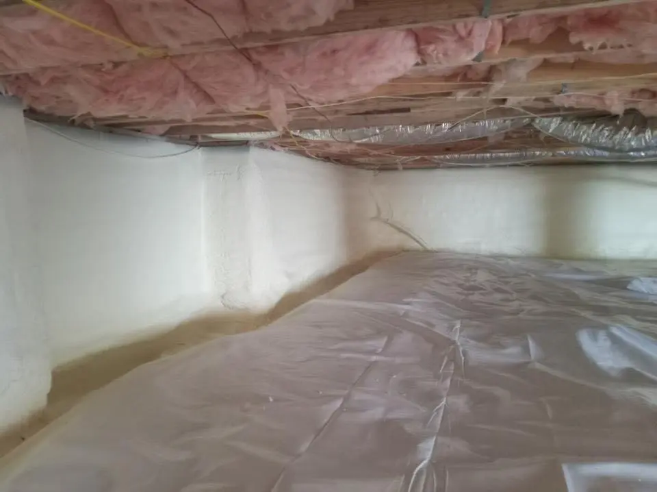Crawl space encapsulation with closed-cell spray foam for Commercial Roof Restoration in Commerce
